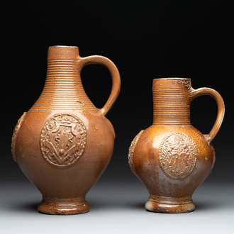 Two armorial stoneware jugs, Raeren, one dated 1586, 16/17th C.