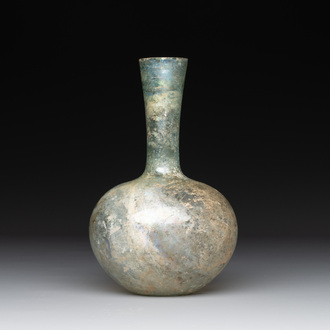A Roman glass bottle with a conical neck, 4/5th C.