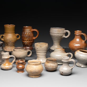 14 German stoneware jugs, mugs and vessels, 14/16th C.