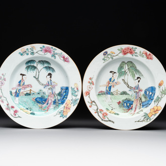 A pair of Chinese famille rose 'ladies in a garden' plates, Yongzheng