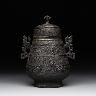 A Chinese archaistic bronze 'Taotie' wine vessel and cover, 'you 卣', Ming