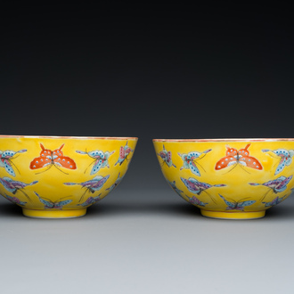 A pair of Chinese famille rose yellow-ground 'butterfly' bowls, Tongzhi mark, 20th C.
