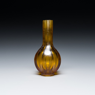 A Chinese facetted translucent amber-coloured Peking glass bottle vase, Qianlong mark, 19th C.