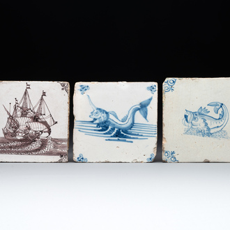 Two blue and white Dutch Delft 'sea monster' tiles and a manganese 'ship' tile, 17/18th C.
