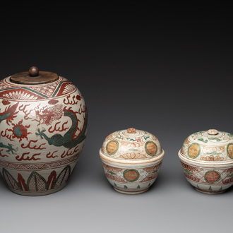A Chinese Swatow green- and red-enamelled 'dragon' jar and a pair of covered bowls, Ming
