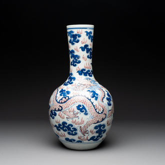 A Chinese blue, white and copper-red 'dragon and phoenix' vase, 19th C.