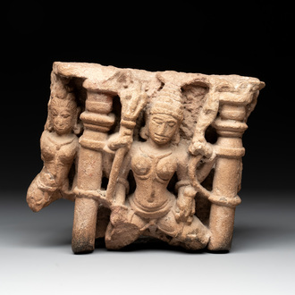 An Indian architectural red sandstone fragment with divinities, 13th C.