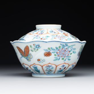 An exceptional Chinese gilt-decorated doucai and famille rose covered bowl with butterflies and floral design, Jiaqing mark and of the period