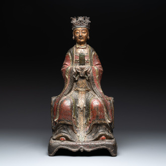 A large Chinese polychrome-lacquered and gilt bronze Daoist immortal, 17th C.