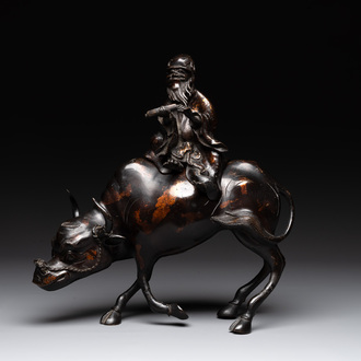 A Chinese gold-splashed bronze incense burner in the shape of an immortal riding a buffalo, 19th C.