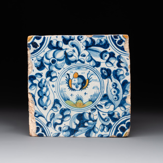 A fine Dutch Delft polychrome maiolica tile with a cherub, ca. 1600