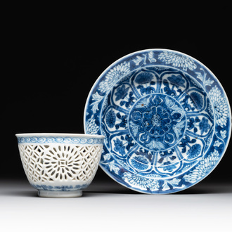 A Chinese blue and white reticulated double-walled cup and saucer, lingzhi mark, Kangxi