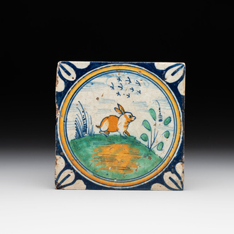 A polychrome Dutch Delft maiolica 'medallion' 'hare' tile, late 16th C.