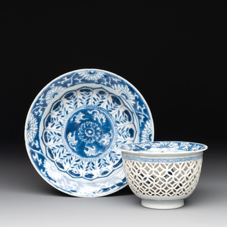 A Chinese blue and white reticulated double-walled cup and saucer, fu mark, Kangxi