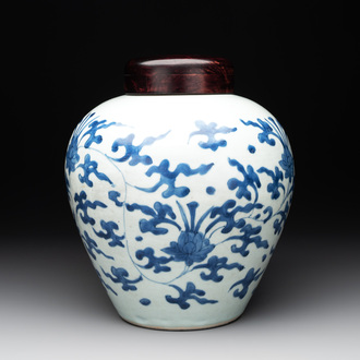 A Chinese blue and white 'lotus scroll' vase with wooden cover, Kangxi