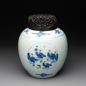 A Chinese blue and white 'playing boys' vase and wooden cover, Kangxi
