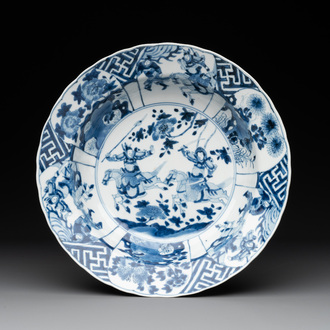 A Chinese blue and white 'warriors on horseback' 'klapmuts' bowl, Kangxi mark and of the period