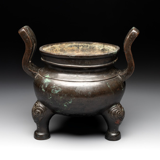A Chinese bronze tripod censer with two handles, Ming