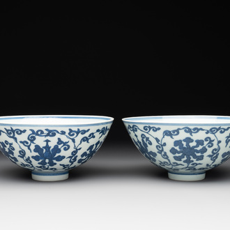 A pair of Chinese blue and white 'lotus scroll' bowls, Yongzheng mark and possibly of the period