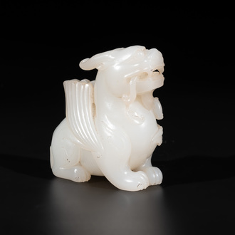 A Chinese white jade carving of a mythic animal, 19/20th C.