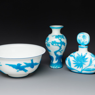 A Chinese blue-overlay white Beijing glass 'meiping' vase, a bowl and a bottle, 19/20th C.