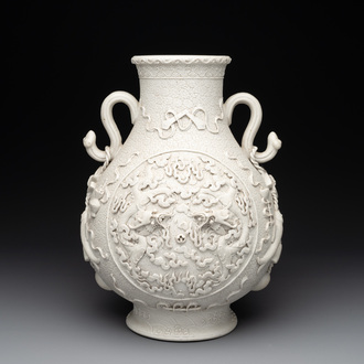 A Chinese white-glazed biscuit 'hu' vase with dragons, Qianlong mark, 19/20th C.