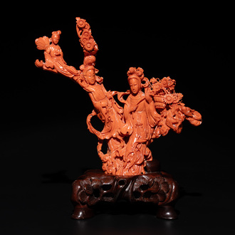 A Chinese red coral group of goddesses on wooden stand, 19/20th C.