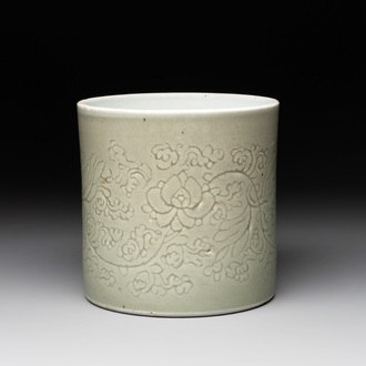 A Chinese incised celadon-glazed 'lotus scroll' brush pot, Kangxi