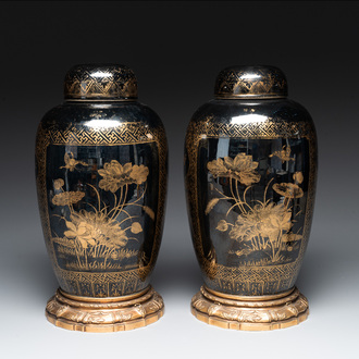 A pair of Chinese gilt-decorated mirror-black-glazed jars and covers on gilt bronze mounts, 19th C.