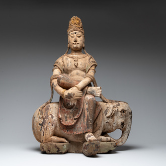 A large Chinese polychromed wooden Guanyin seated on an elephant, Republic