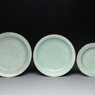 Three Chinese celadon-glazed dishes with floral anhua design, 18/19th C.
