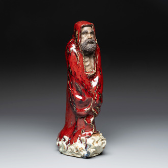 A Chinese Shiwan flambé-glazed figure of a Luohan, Deng 邓 seal mark, dated 1927