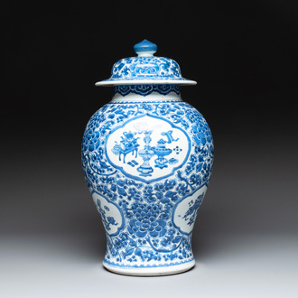 A Chinese blue and white 'antiquities and peony scrolls' vase and cover, Kangxi