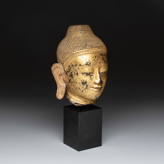 A Burmese gilt-lacquered bronze head of Buddha, 19th C.