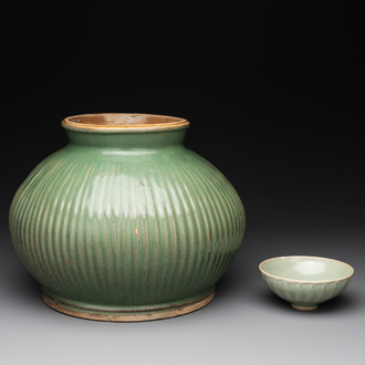 A Chinese Longquan celadon 'lotus' bowl and a large green-glazed jar, Ming and later