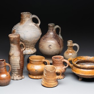 Eight stoneware jugs and mugs, and a glazed pottery vessel, Germany and The Netherlands, 16/17th C.