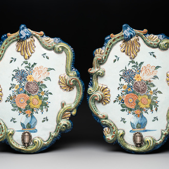 A pair of polychrome Dutch Delft plaques mounted as wall sconces with silver mounts, 18th C.
