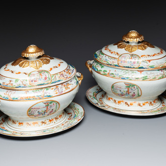 A pair of large Chinese Canton famille rose 'mandarin subject' tureens on stands, 19th C.