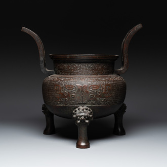 A large Chinese bronze archaistic 'taotie' tripod censer, 18th C.