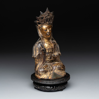 A Chinese parcel-gilt bronze Guanyin, Ming