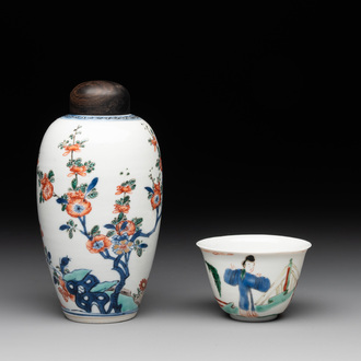 A Chinese famille verte ovoid tea caddy with floral design and a cup with figural design, Kangxi