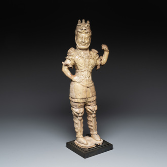 A Chinese stoneware cream-glazed sculpture of a warrior, possibly Tang