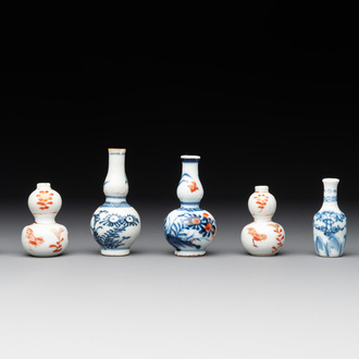 Seven Chinese iron-red, blue and white miniature vases, Kangxi
