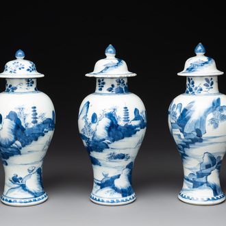 Three Chinese blue and white 'river landscape' vases and covers, Kangxi