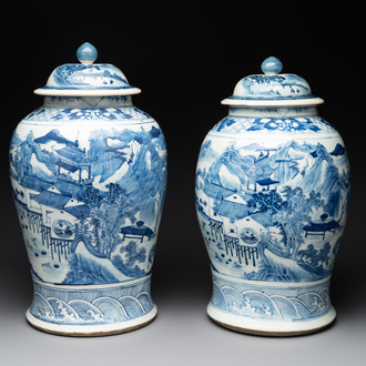 A near pair of Chinese blue and white 'landscape' vases and covers, 19th C.