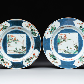 A pair of Chinese famille verte blue-ground 'landscape' plates, Kangxi/Yongzheng