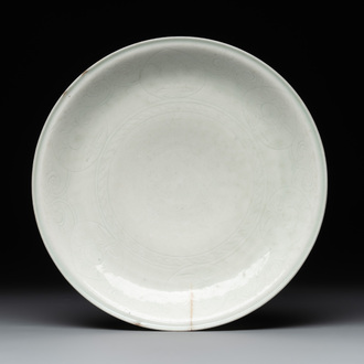 A Gombroon ware plate with incised floral design, Iran, Safavid, late 17/early 18th C.