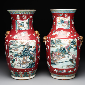 A pair of Chinese famille rose ruby-ground 'landscape' vases, 19th C.