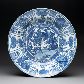 A large Chinese blue and white 'kraak' dish with birds among flowering branches, Wanli