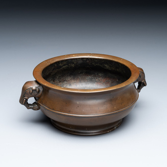 A Chinese bronze elephant-head-handled censer, Wan Shou Wu Jiang 萬壽無疆 mark, 19th C.